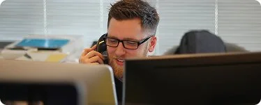Marketing specialist reviewing campaign performance on a monitor